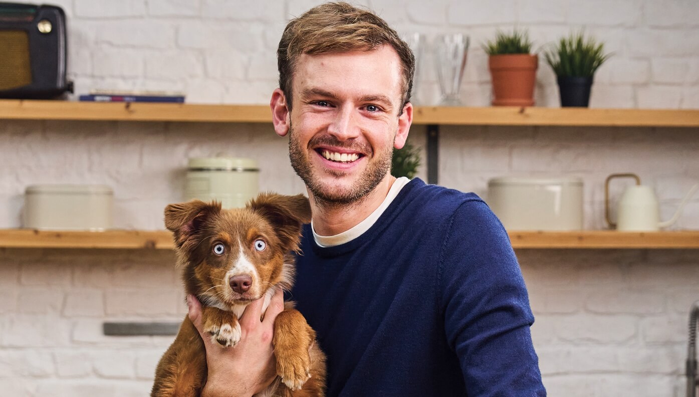 "how to stop your puppy from biting" with a dog and plants