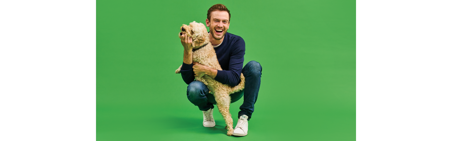 picture of Rory the vet playing with a dog
