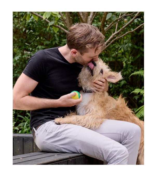 picture of Rory The Vet cuddling a dog